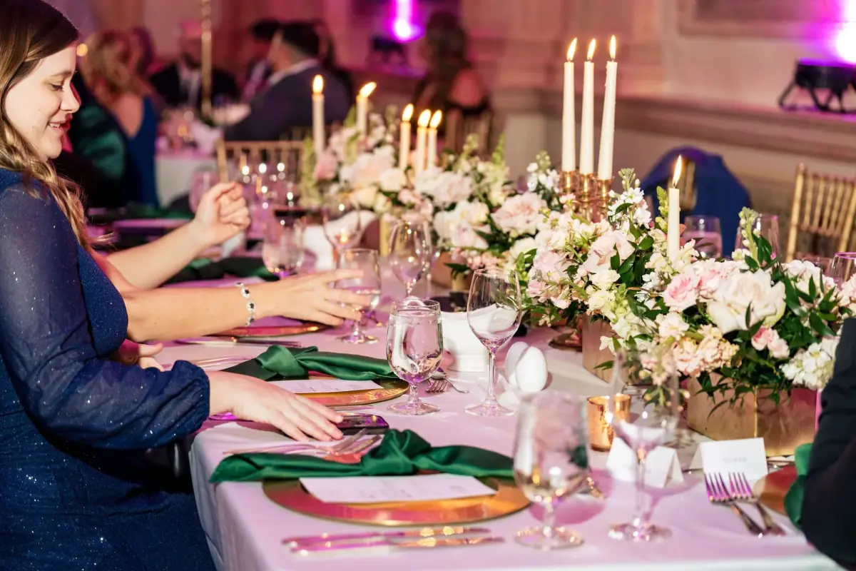 Candlelit reception table set with florals and fine details