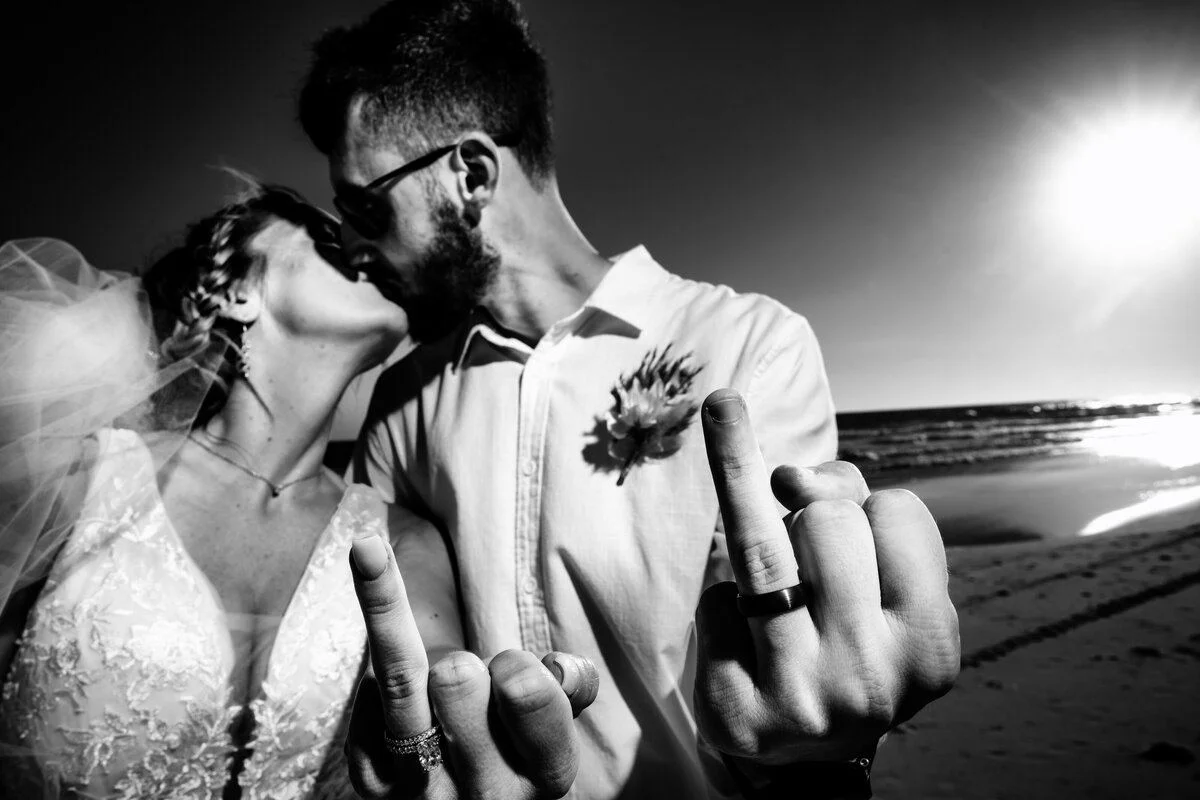 Heads nestled close on the sand beneath the night sky
